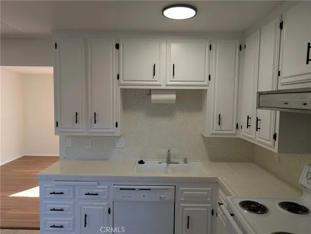 a view of cabinets with washer and dryer