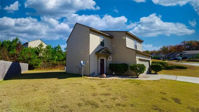 a front view of a house with a yard