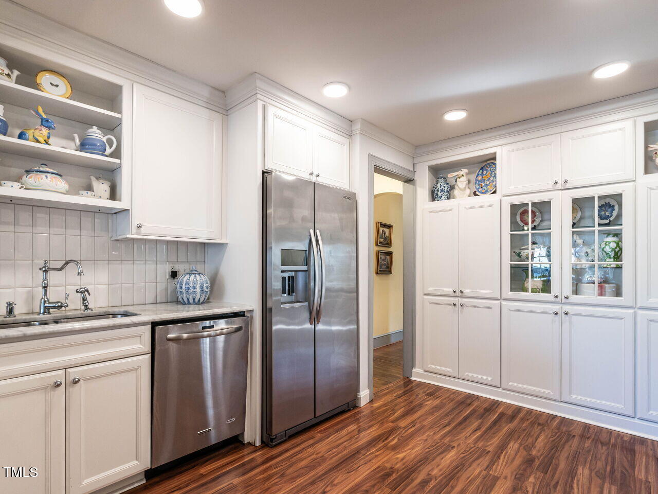 2521 St Marys Street Raleigh, NC 27609 - Photo 11 of 29 a kitchen with stainless steel appliances a refrigerator sink and cabinets