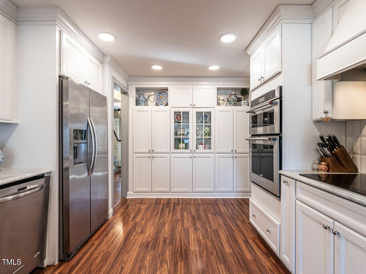 2521 St Marys Street Raleigh, NC 27609 - Photo 12 of 29 a kitchen with stainless steel appliances a refrigerator and wooden floor