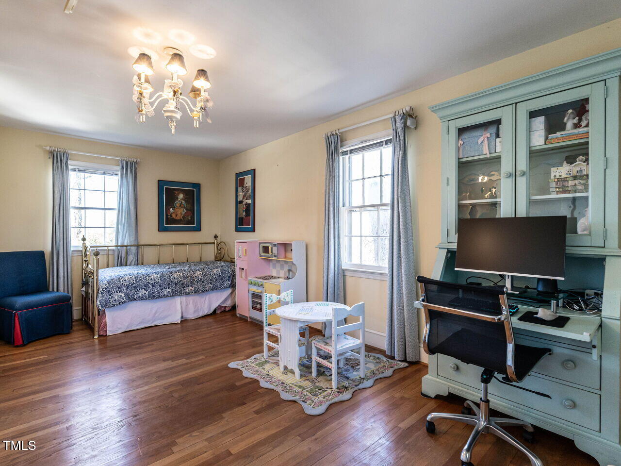 2521 St Marys Street Raleigh, NC 27609 - Photo 17 of 29 a living room with furniture and a flat screen tv