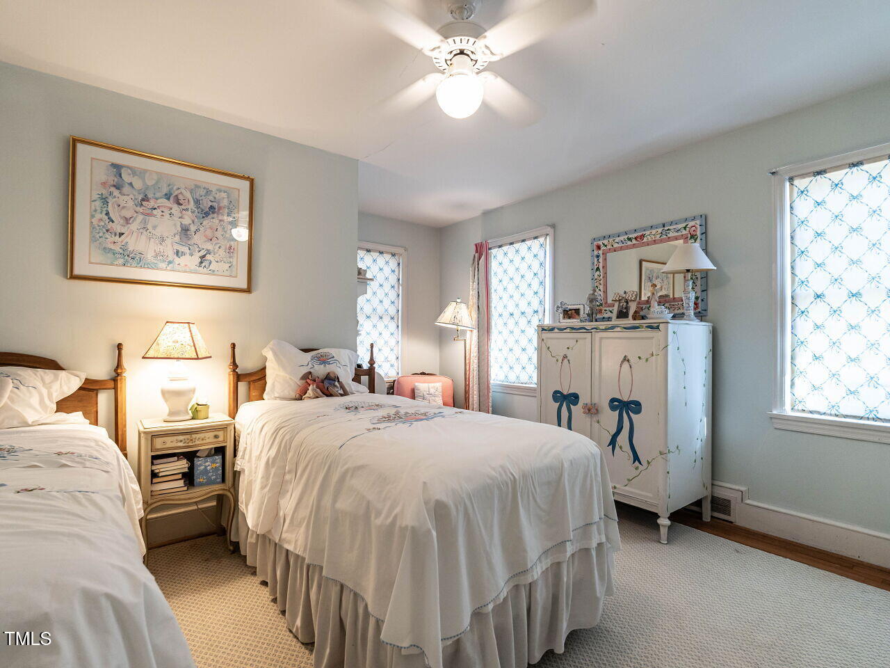 2521 St Marys Street Raleigh, NC 27609 - Photo 20 of 29 a bed room with a bed and a chandelier