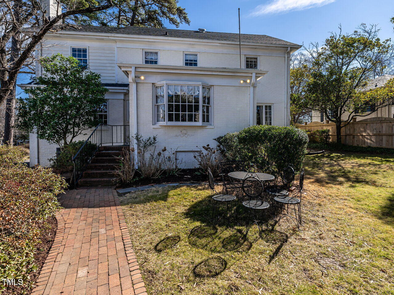 2521 St Marys Street Raleigh, NC 27609 - Photo 25 of 29 a backyard of a house with yard and outdoor seating