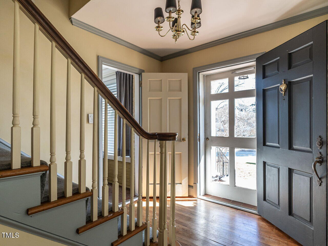 2521 St Marys Street Raleigh, NC 27609 - Photo 4 of 29 a view of an entryway with wooden floor and door