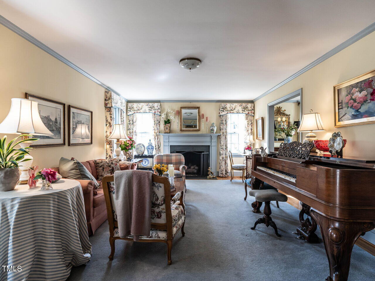 2521 St Marys Street Raleigh, NC 27609 - Photo 5 of 29 a living room with furniture and a fireplace