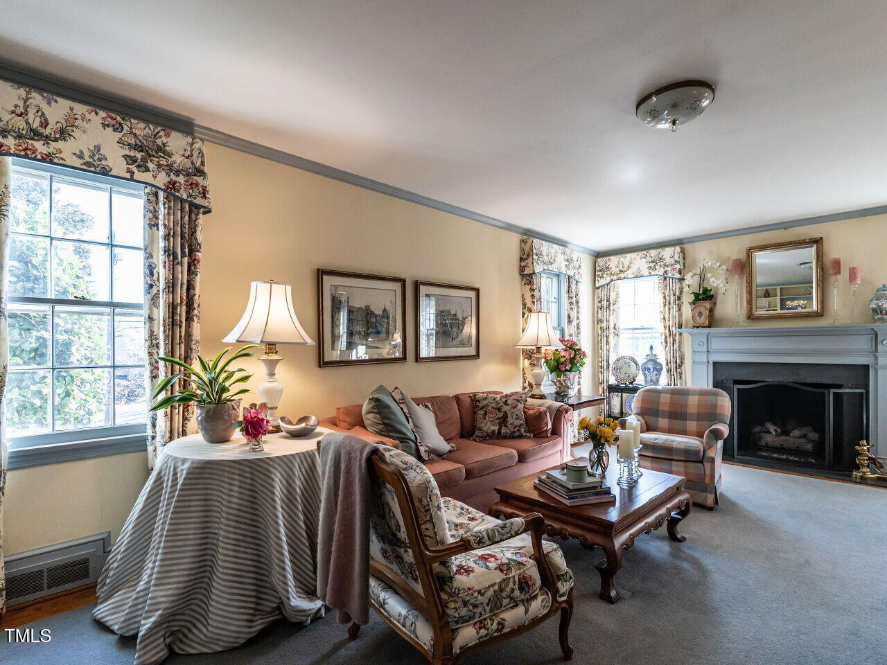 2521 St Marys Street Raleigh, NC 27609 - Photo 6 of 29 a living room with furniture and a fireplace