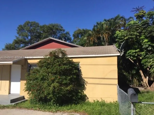 a house with trees in the background
