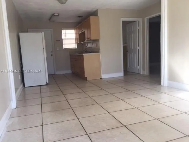 a kitchen with stainless steel appliances a refrigerator and a counter top space