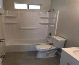 330-332 Fillmore Street Fillmore, CA 93015 - Photo 8 of 8 a bathroom with a toilet and a shower
