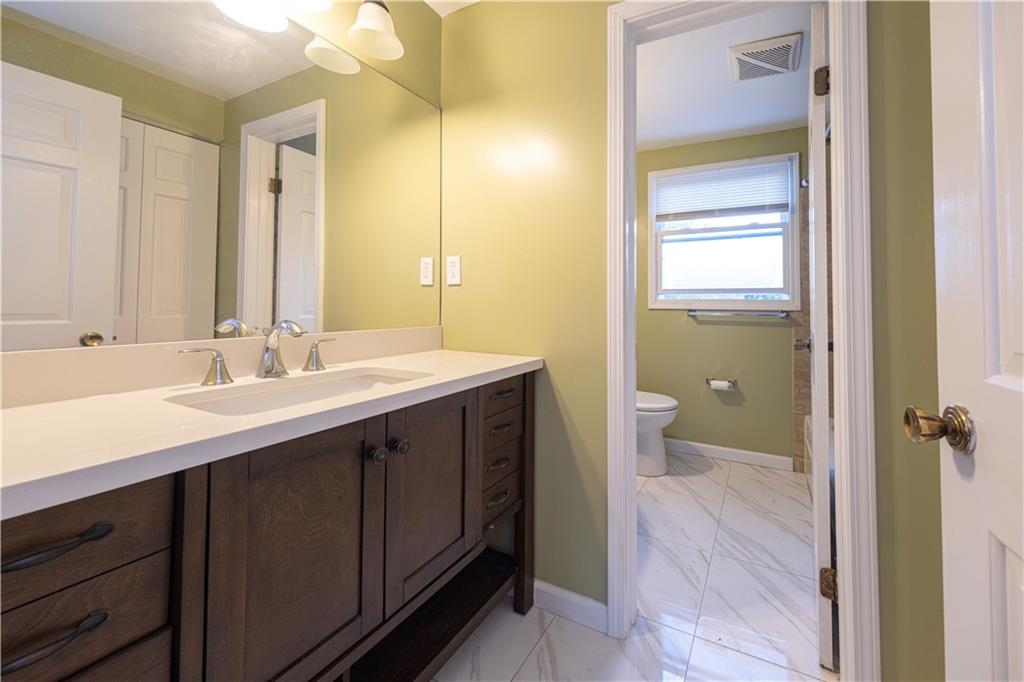 129 Mayberry Drive Monroeville, PA 15146 - Photo 21 of 40 a bathroom with a double vanity sink toilet and shower