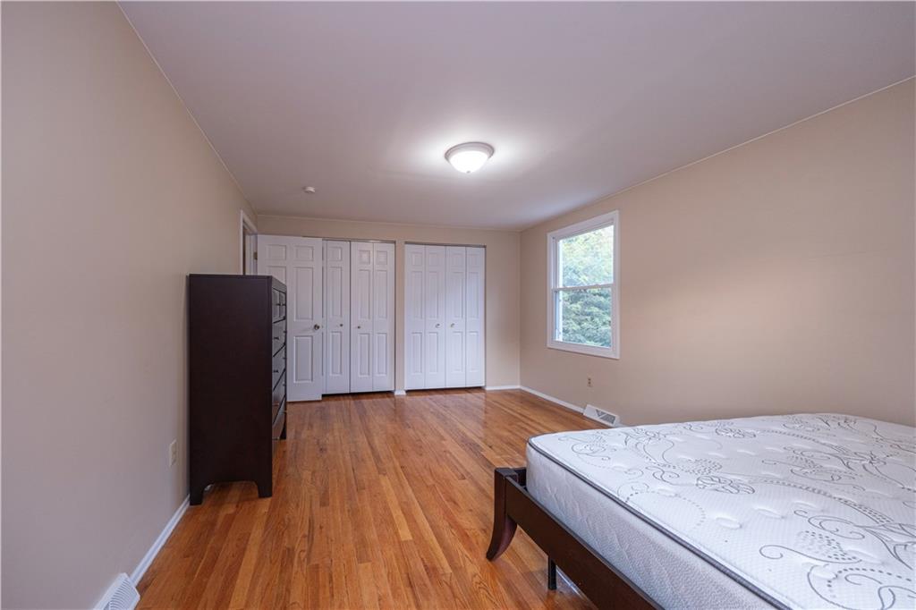 129 Mayberry Drive Monroeville, PA 15146 - Photo 23 of 40 an empty room with wooden floor and windows