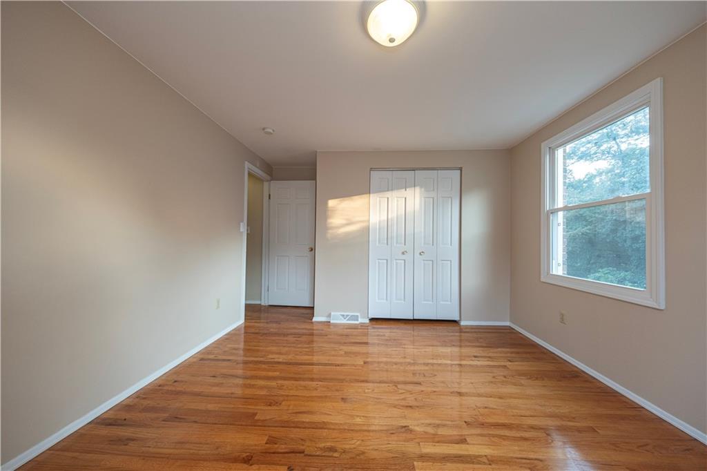 129 Mayberry Drive Monroeville, PA 15146 - Photo 25 of 40 a view of an empty room with wooden floor and a window