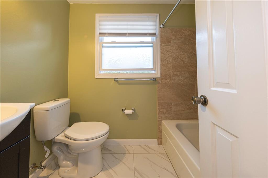 129 Mayberry Drive Monroeville, PA 15146 - Photo 28 of 40 a white toilet sitting next to a bath tub