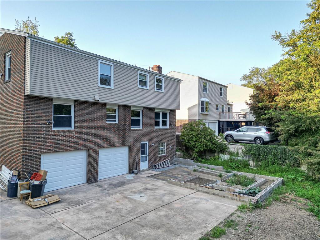 129 Mayberry Drive Monroeville, PA 15146 - Photo 34 of 40 a front view of a house with a yard and garage