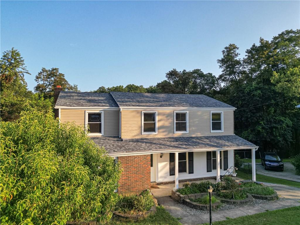 129 Mayberry Drive Monroeville, PA 15146 - Photo 39 of 40 a front view of a house with a garden