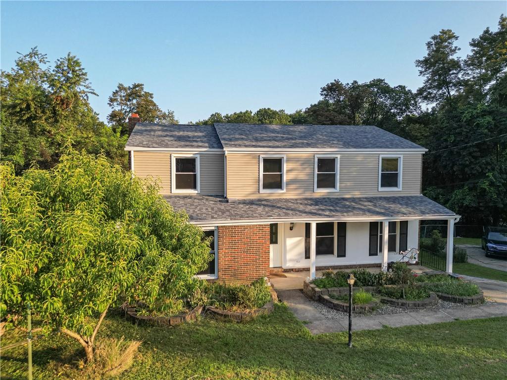 129 Mayberry Drive Monroeville, PA 15146 - Photo 40 of 40 a front view of a house with a yard and potted plants
