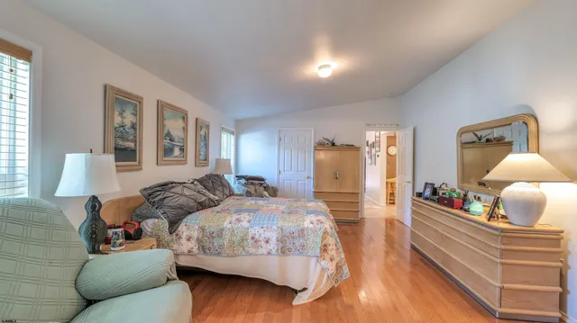 a bedroom with bed and window