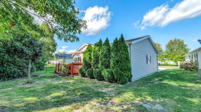 a view of a back yard of the house