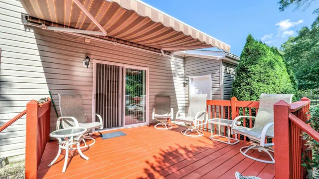 a view of a patio with a table and chairs