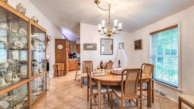 a view of a dining room with furniture window and outside view