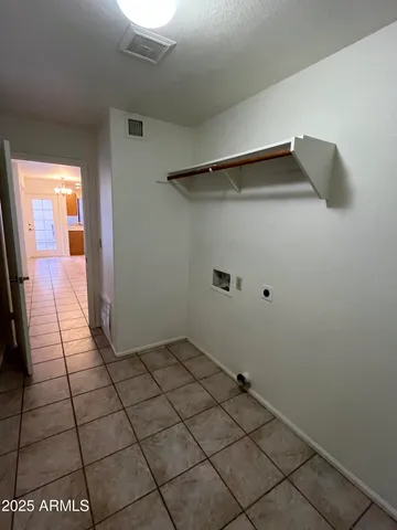 a bathroom with a toilet and a mirror