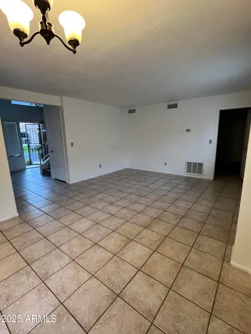 a view of a kitchen with a sink and cabinets
