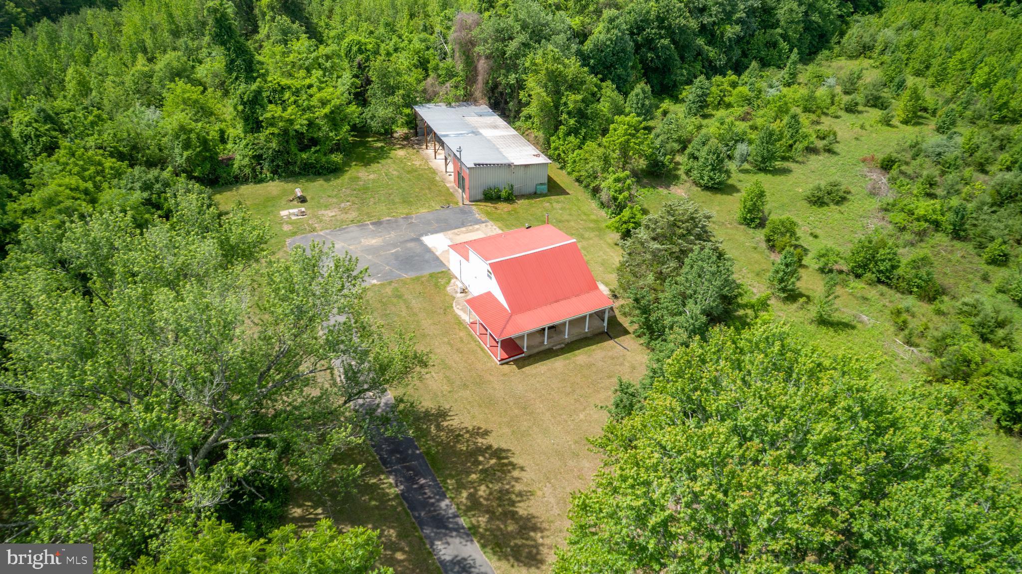 10827 Catharpin Road Spotsylvania, VA 22553 - Photo 36 of 39 an aerial view of a house with a yard and trees
