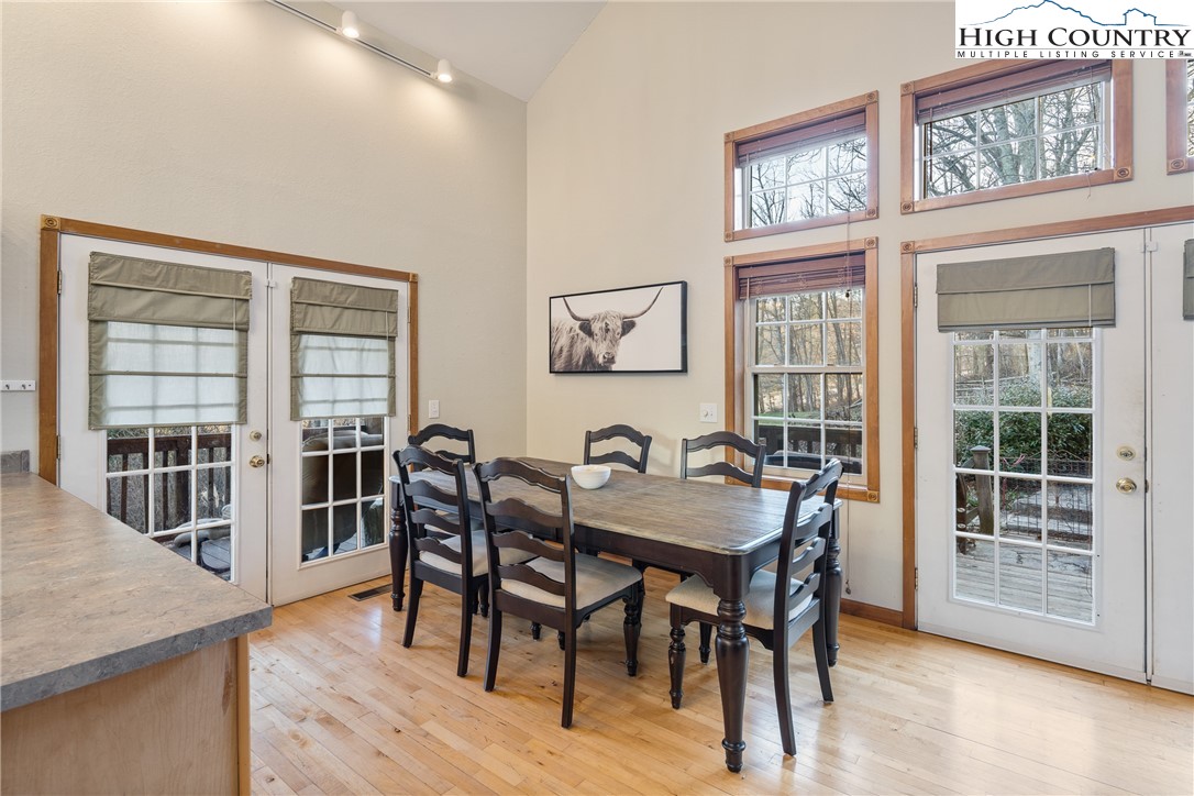 144 Grandfather Farms Road Banner Elk, NC 28604 - Photo 18 of 41 a view of a dining room with furniture and wooden floor