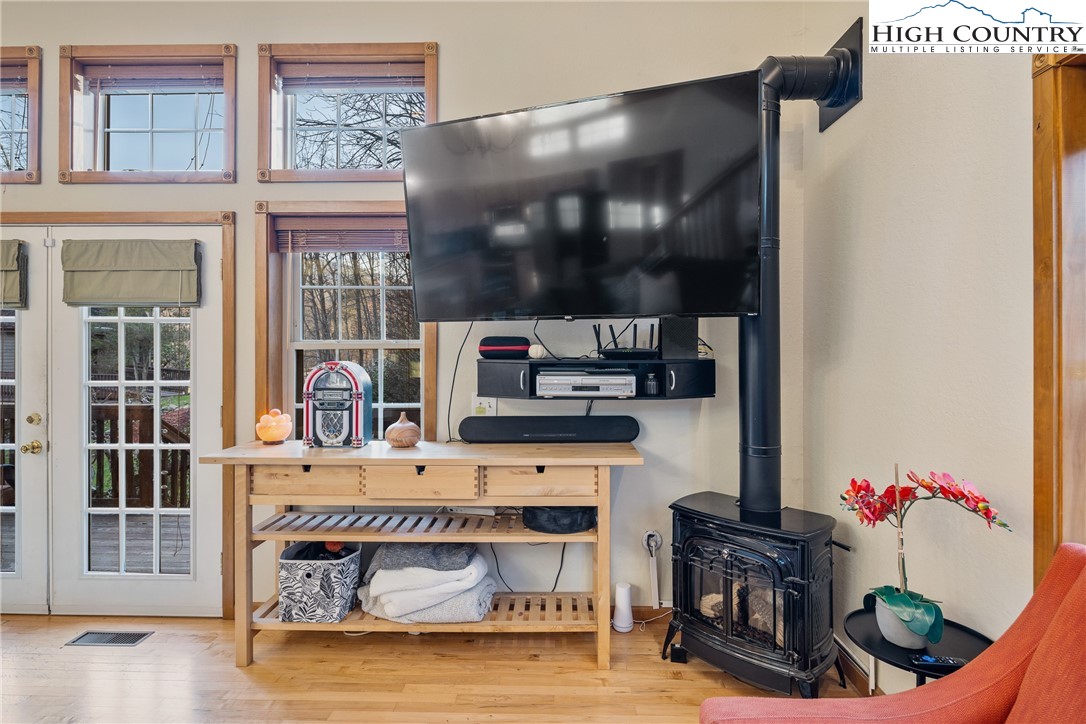 144 Grandfather Farms Road Banner Elk, NC 28604 - Photo 19 of 41 a living room with furniture and a flat screen tv