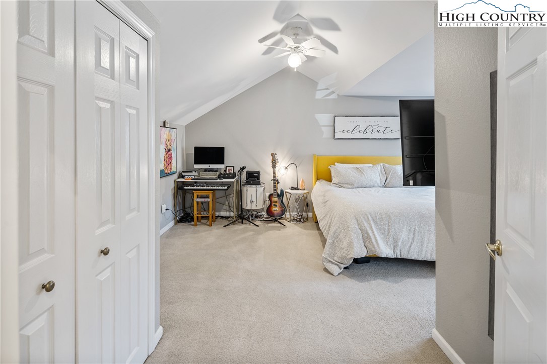 144 Grandfather Farms Road Banner Elk, NC 28604 - Photo 22 of 41 a bedroom with furniture and a flat screen tv