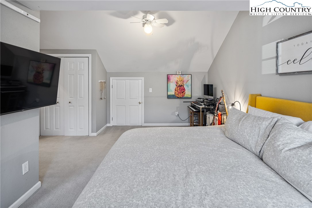 144 Grandfather Farms Road Banner Elk, NC 28604 - Photo 24 of 41 a living room with a couch and a flat screen tv