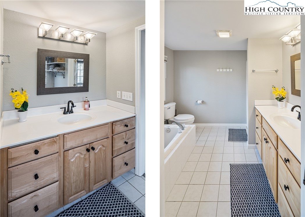 144 Grandfather Farms Road Banner Elk, NC 28604 - Photo 25 of 41 a spacious bathroom with a double vanity sink a mirror a bathtub and a window