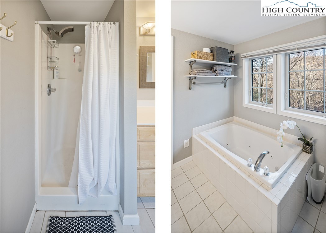 144 Grandfather Farms Road Banner Elk, NC 28604 - Photo 26 of 41 a bathroom with a bathtub and a shower