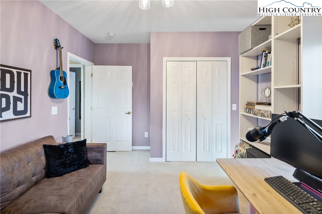 144 Grandfather Farms Road Banner Elk, NC 28604 - Photo 29 of 41 a living room with furniture and a window