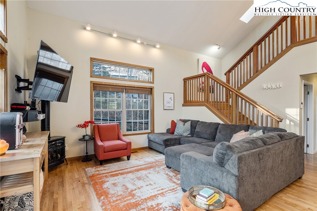 144 Grandfather Farms Road Banner Elk, NC 28604 - Photo 3 of 41 a living room with furniture and a flat screen tv