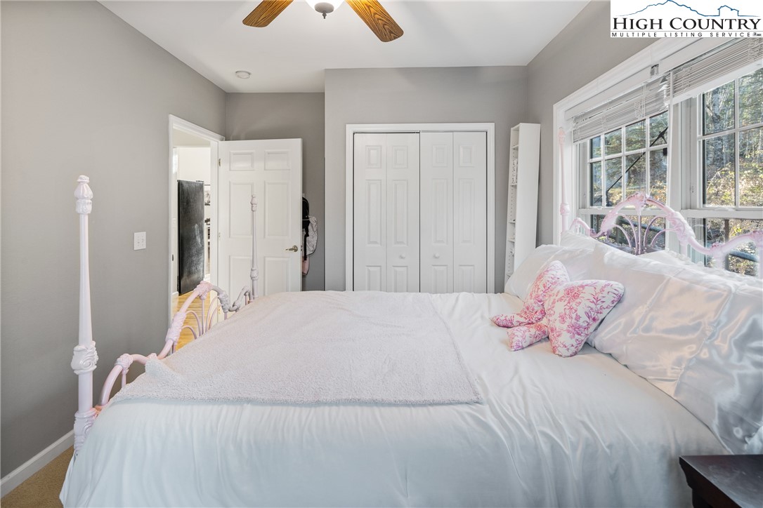 144 Grandfather Farms Road Banner Elk, NC 28604 - Photo 33 of 41 a bedroom with a bed and window