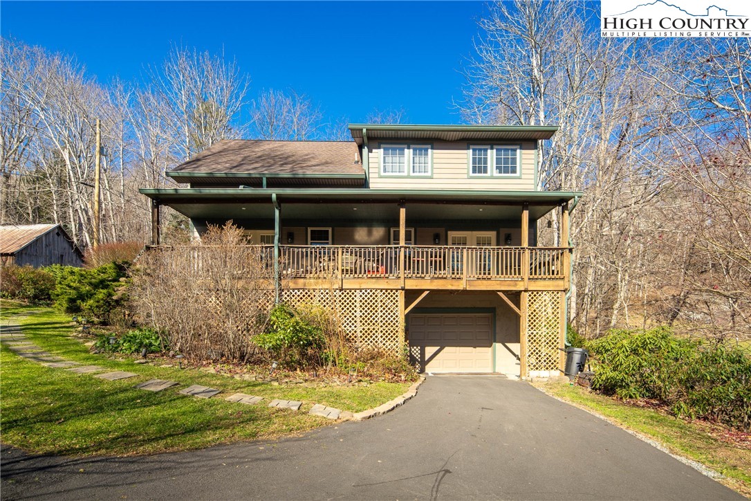 144 Grandfather Farms Road Banner Elk, NC 28604 - Photo 5 of 41 a front view of a house with garden