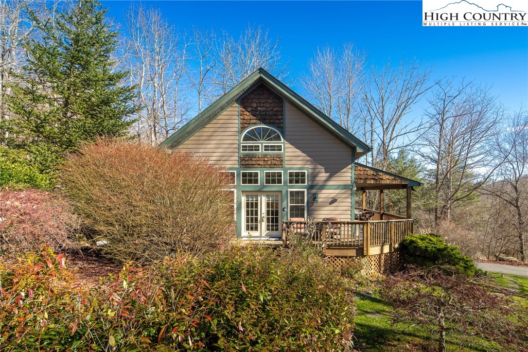 144 Grandfather Farms Road Banner Elk, NC 28604 - Photo 6 of 41 a view of a house with yard and sitting area