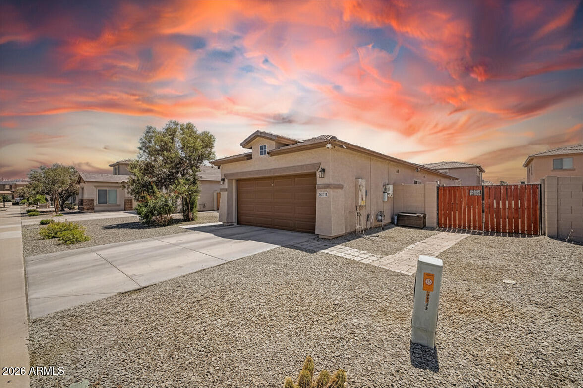 16719 West Rowel Road Surprise, AZ 85387 - Photo 2 of 28 a street view with two buildings