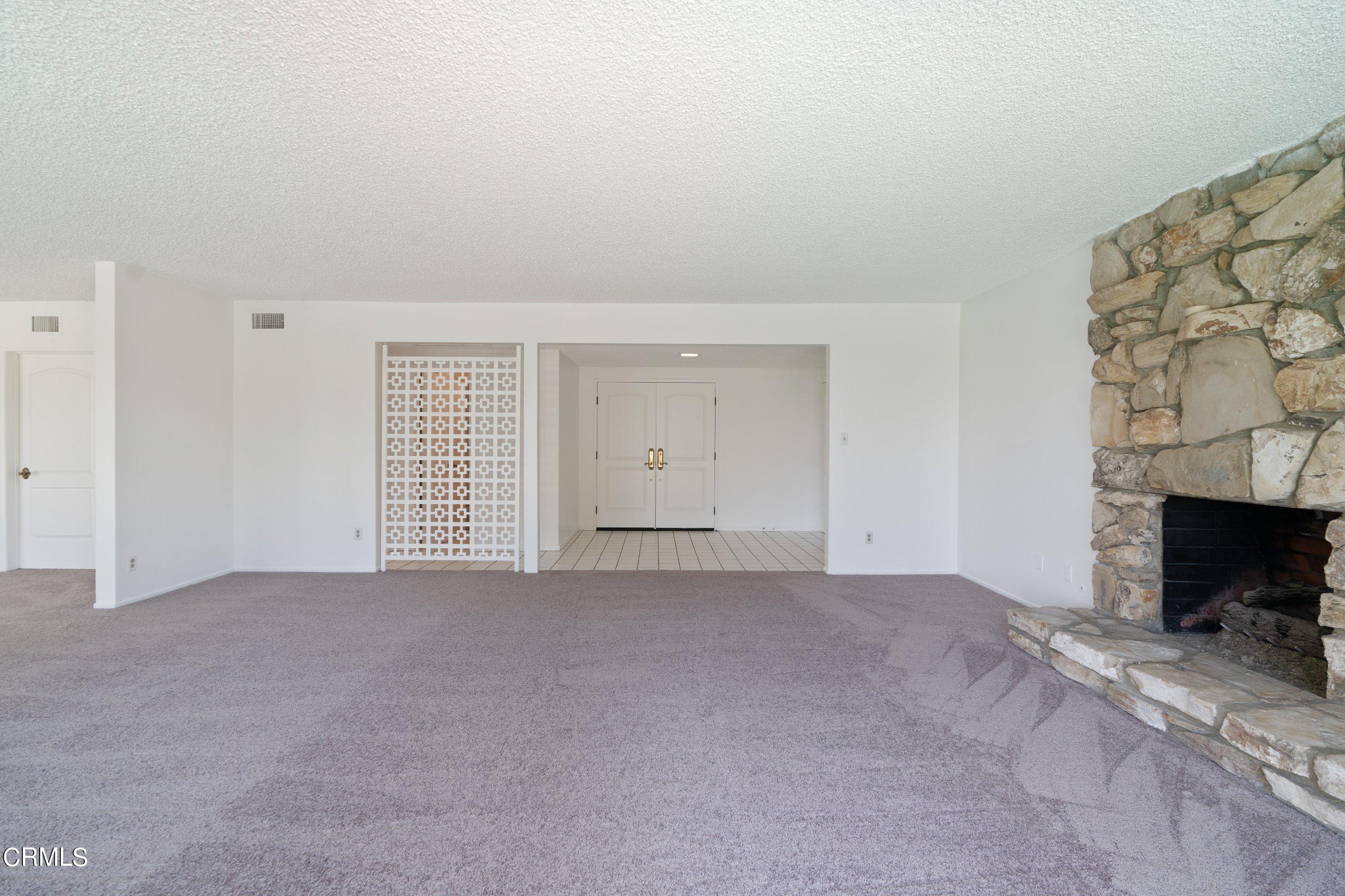 3347 Wrightwood Drive Studio City, CA 91604 - Photo 15 of 44 a view of an empty room with a fireplace