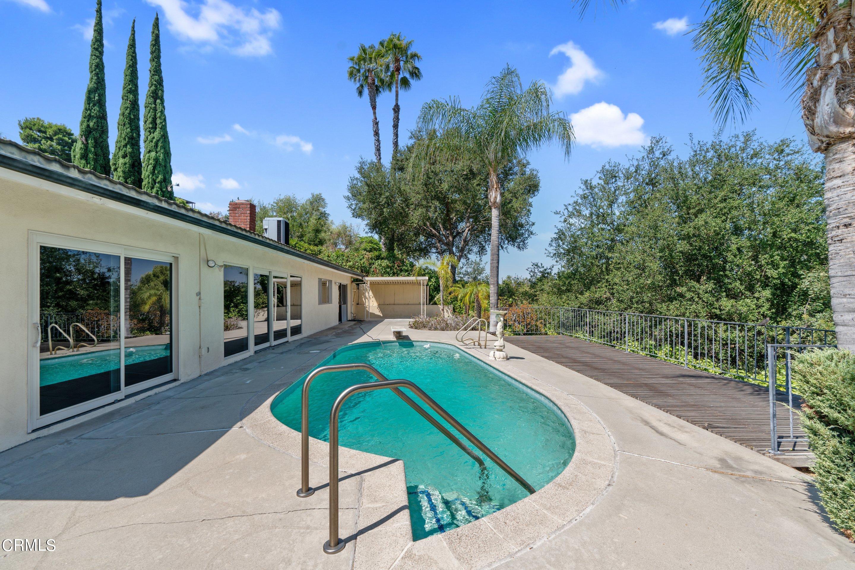 3347 Wrightwood Drive Studio City, CA 91604 - Photo 18 of 44 a view of a swimming pool with a patio