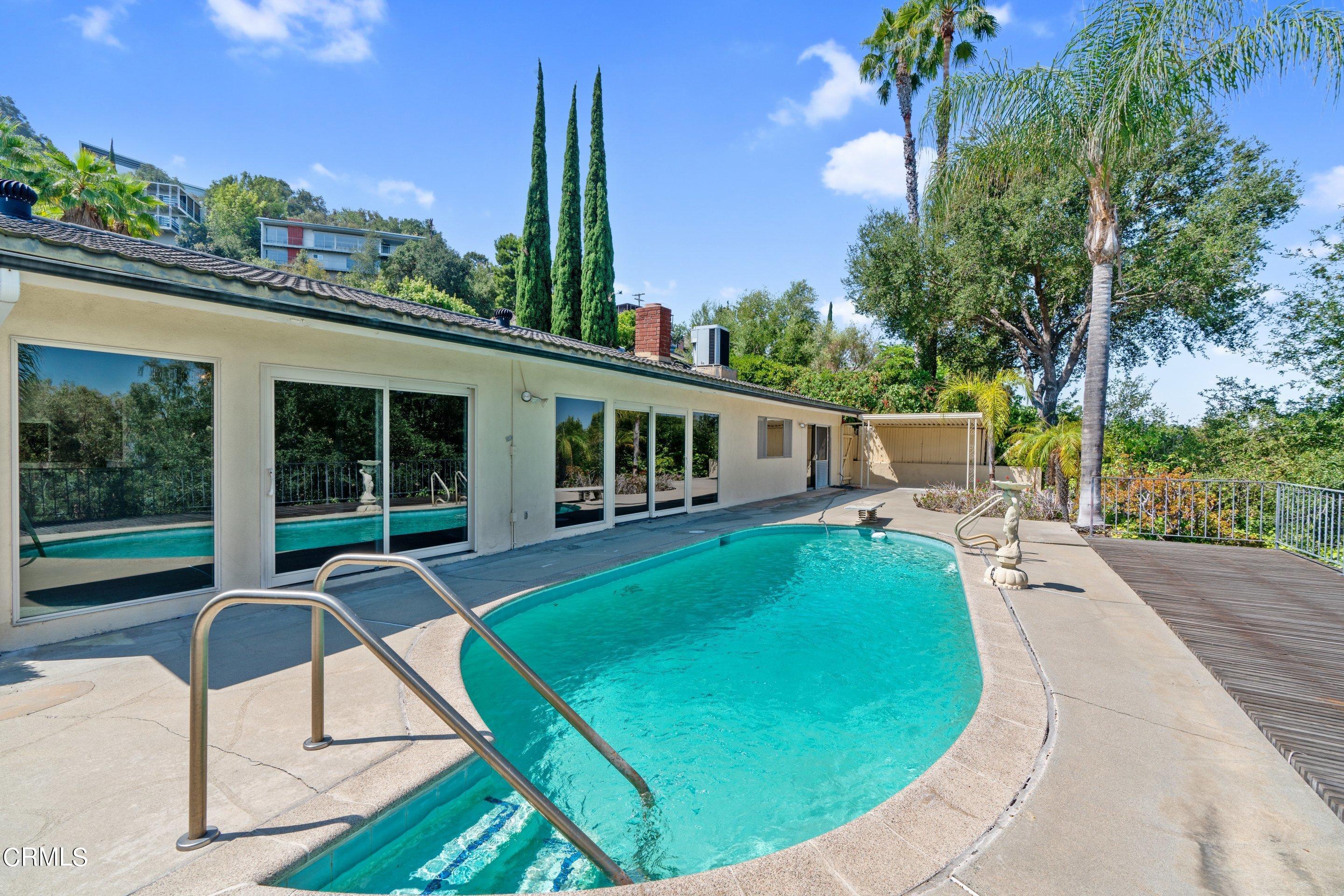 3347 Wrightwood Drive Studio City, CA 91604 - Photo 19 of 44 a view of a house with backyard sitting area and garden