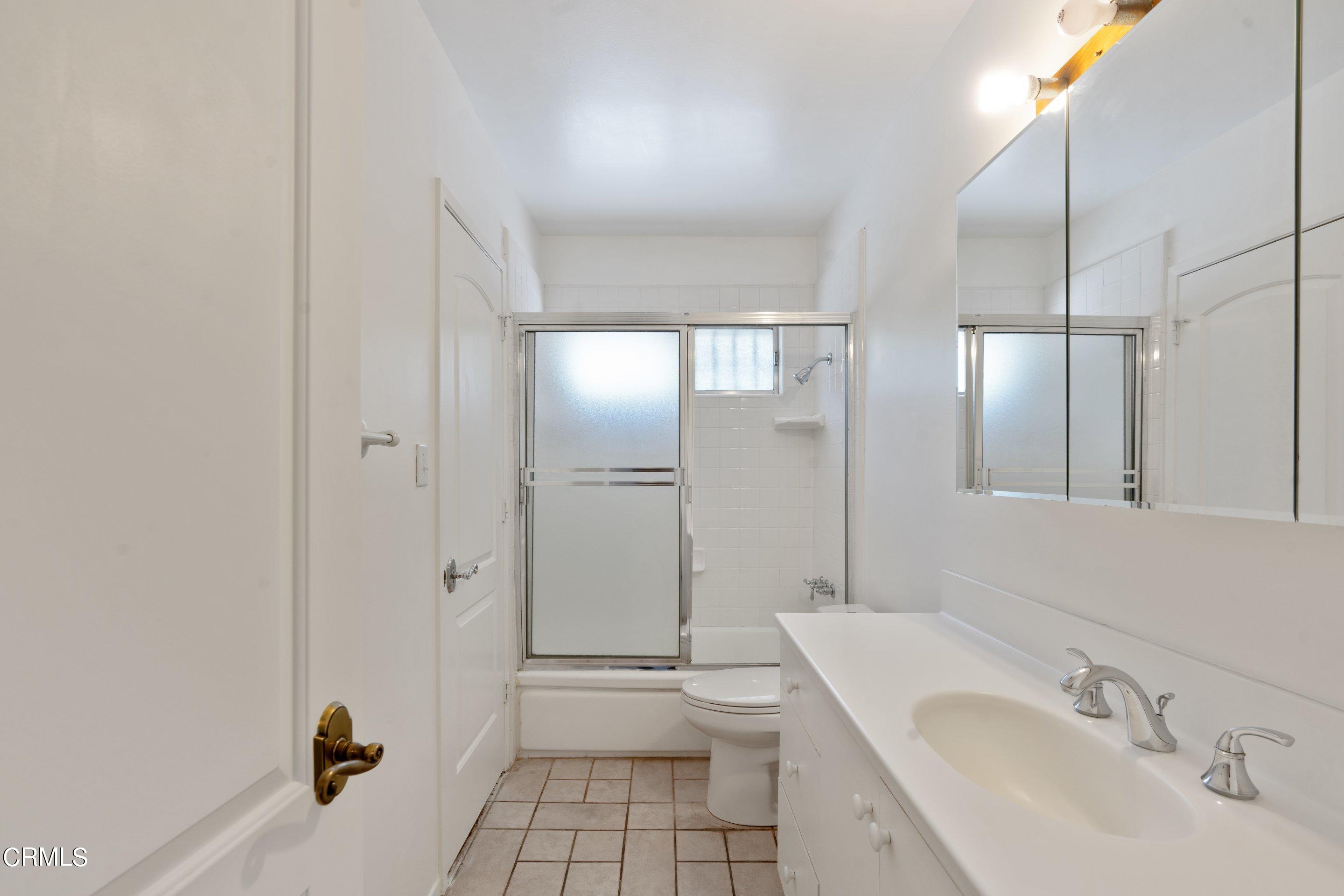 3347 Wrightwood Drive Studio City, CA 91604 - Photo 35 of 44 a bathroom with a sink a toilet and shower