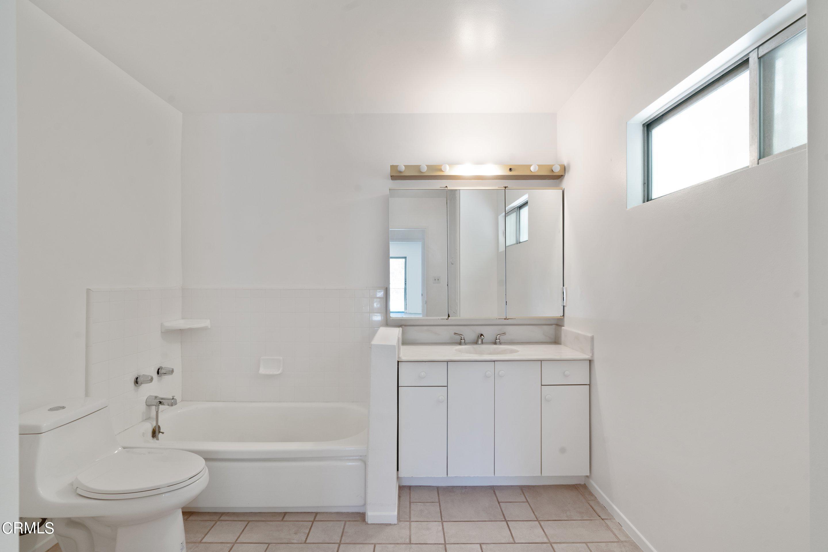 3347 Wrightwood Drive Studio City, CA 91604 - Photo 42 of 44 a bathroom with a sink a toilet and bathtub