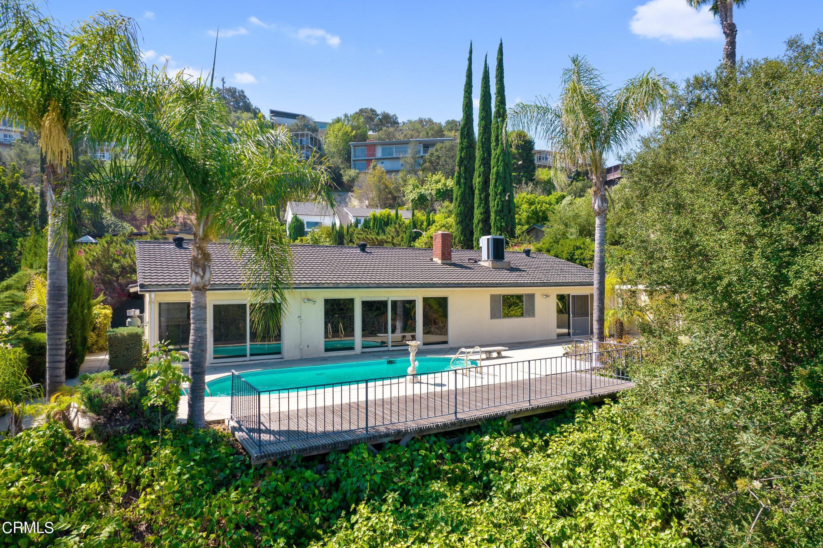 3347 Wrightwood Drive Studio City, CA 91604 - Photo 44 of 44 a front view of a house with a garden and plants