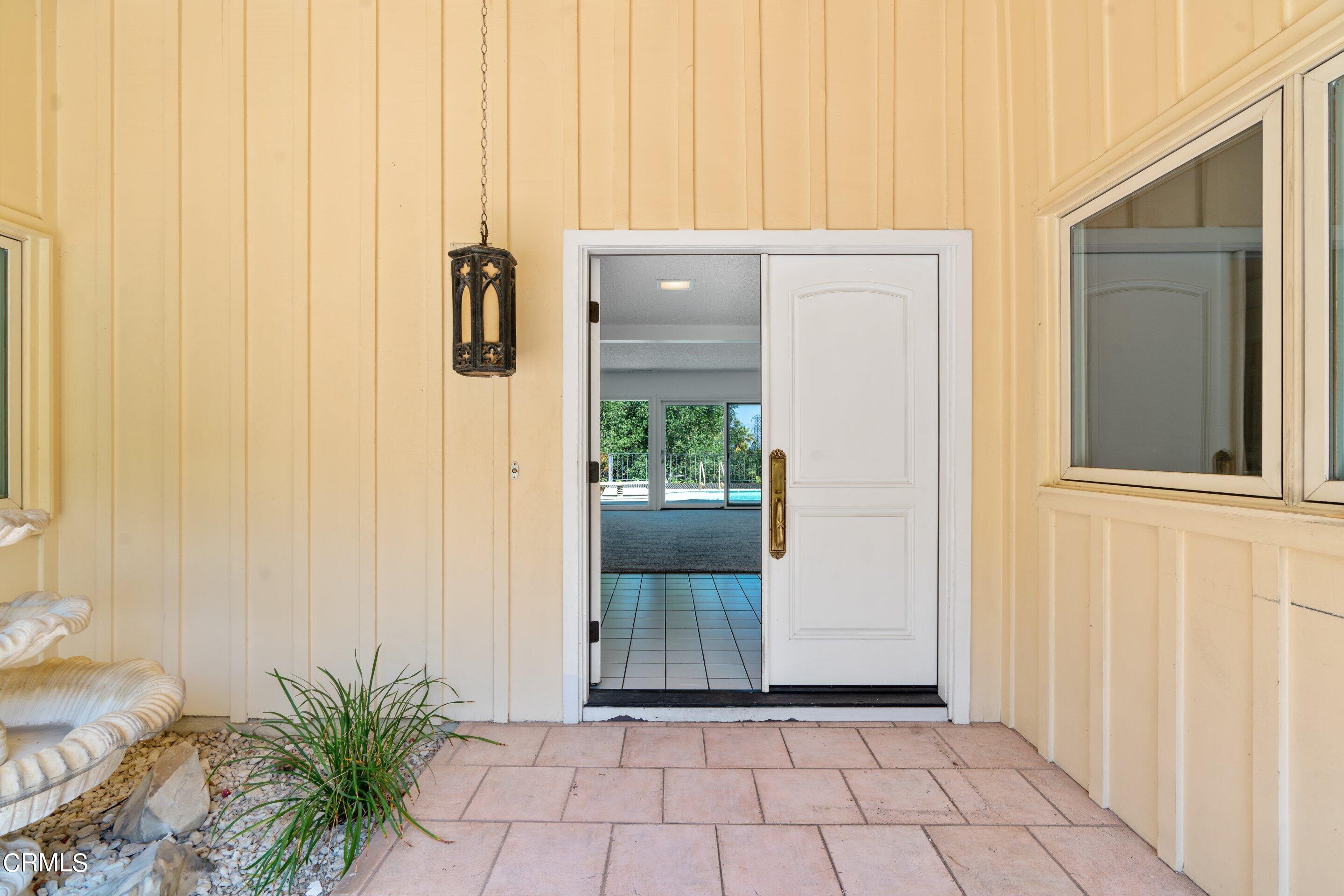 3347 Wrightwood Drive Studio City, CA 91604 - Photo 6 of 44 a view of a hallway with wooden door and glass door