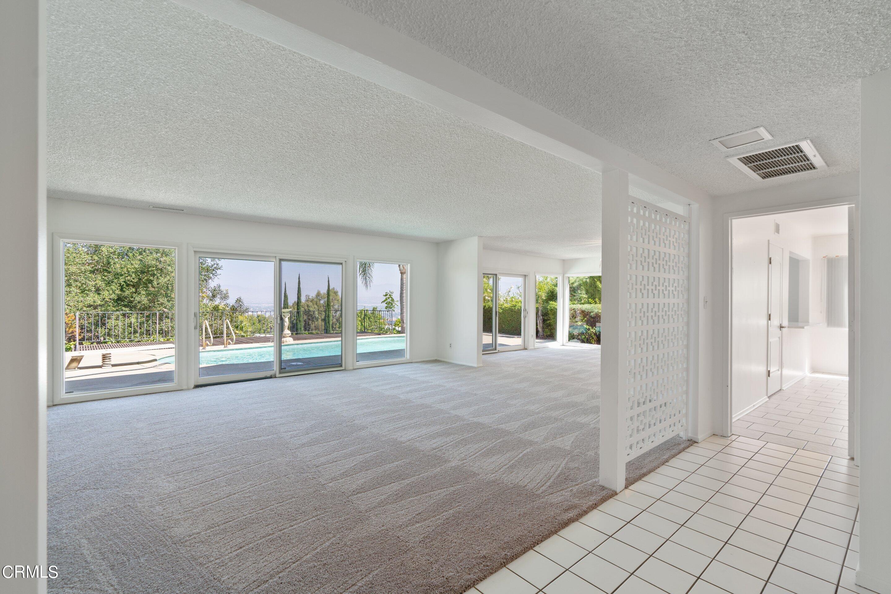 3347 Wrightwood Drive Studio City, CA 91604 - Photo 9 of 44 a view of an empty room with wooden floor and a window