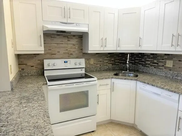 a view of cabinets and sink