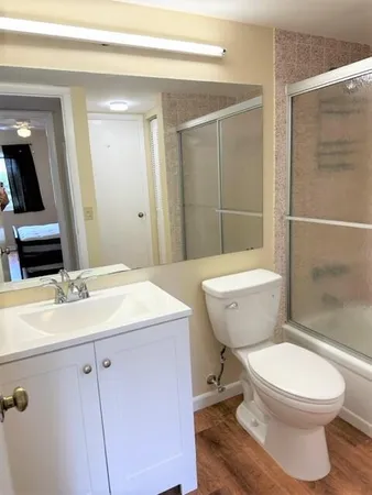 a bedroom with a bed and dresser