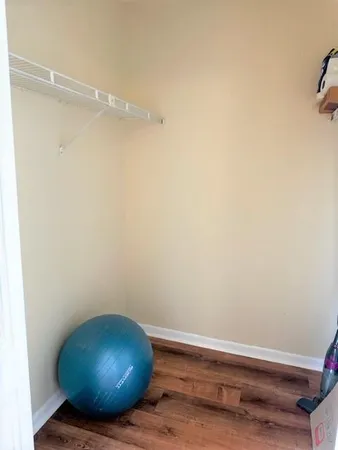 a bedroom with a bed and a mirror